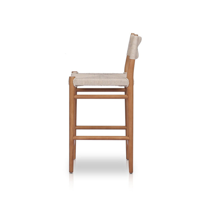 slim, tapered teak frames this woven all-weather wicker counter stool shopkoehndesign interior design calgary furniture shop amy koehn calgary designer