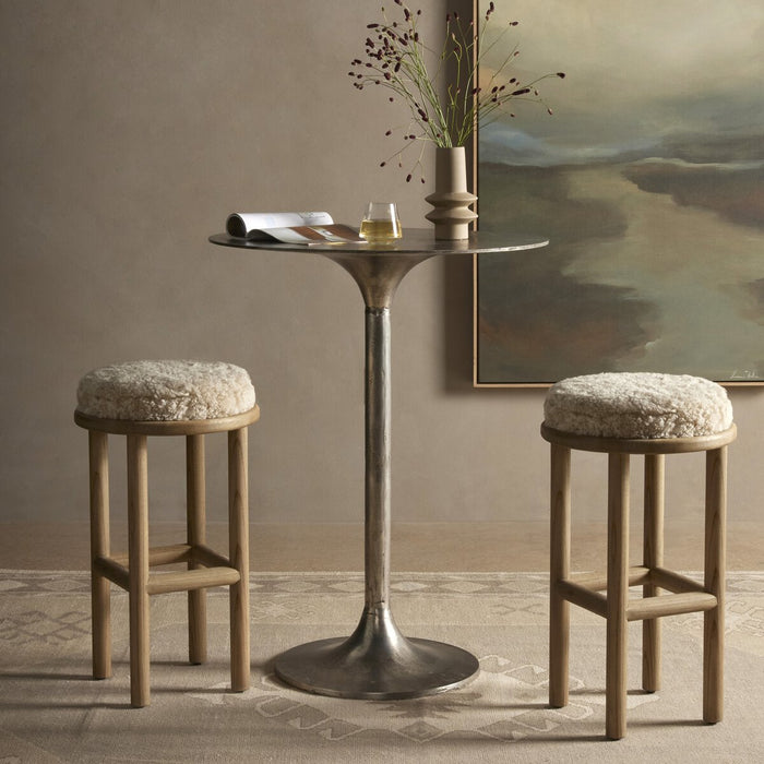 solid parawood round stool with soft beige shearling cushion armless and backless counter stool shopkoehndesign calgary furniture shop amy koehn calgary designer