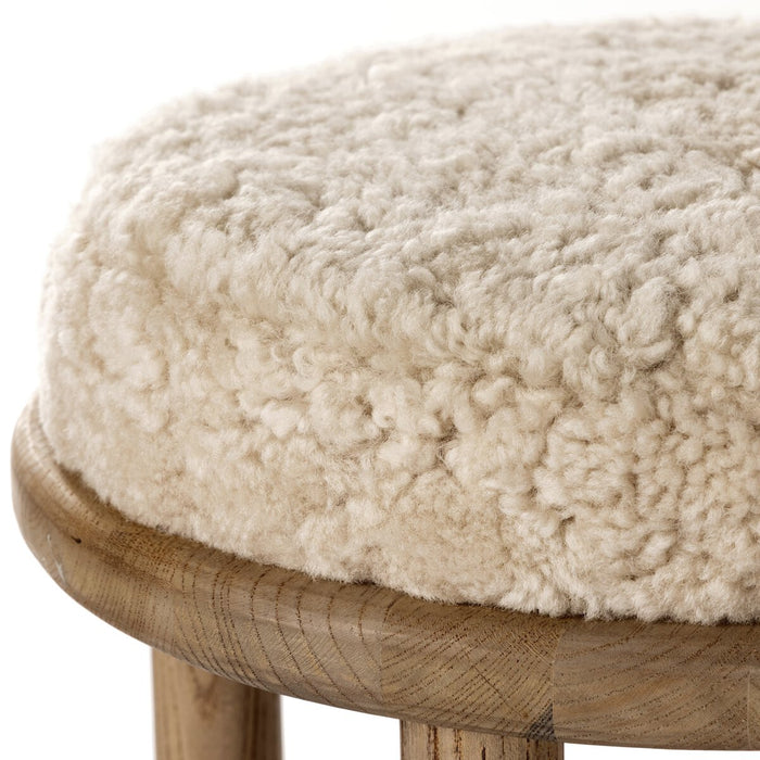 solid parawood round stool with soft beige shearling cushion armless and backless counter stool shopkoehndesign calgary furniture shop amy koehn calgary designer