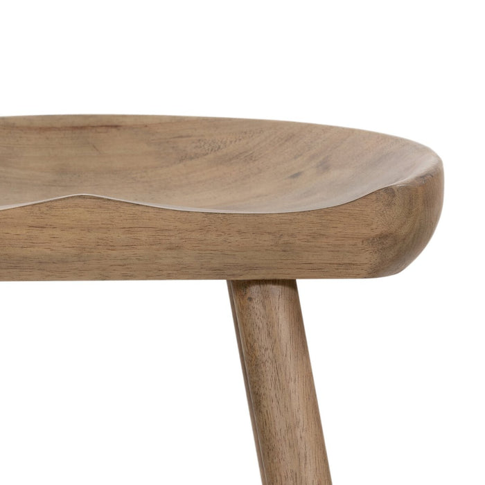 armless and backless sculpted seat parawood with black metal footrest natural solid wood stool shopkoehndesign calgary furniture shop amy koehn calgary designer