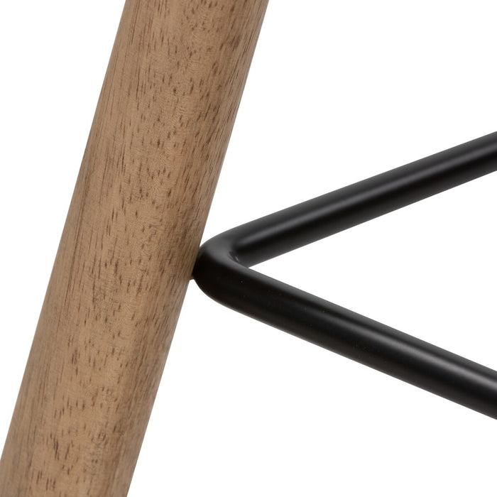armless and backless sculpted seat parawood with black metal footrest natural solid wood stool shopkoehndesign calgary furniture shop amy koehn calgary designer