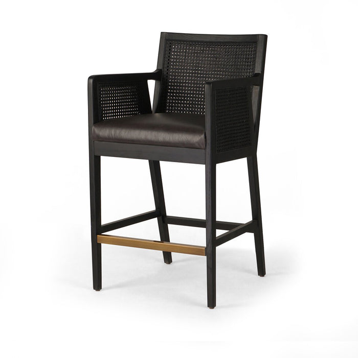 Ebony finished nettlewood frames a textural inlay of dark cane arms and back with top grain dark leather seat with brass kickplate counter stool shopkoehndesign calgary furniture shop amy koehn calgary designer