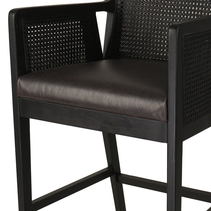 Ebony finished nettlewood frames a textural inlay of dark cane arms and back with top grain dark leather seat with brass kickplate counter stool shopkoehndesign calgary furniture shop amy koehn calgary designer