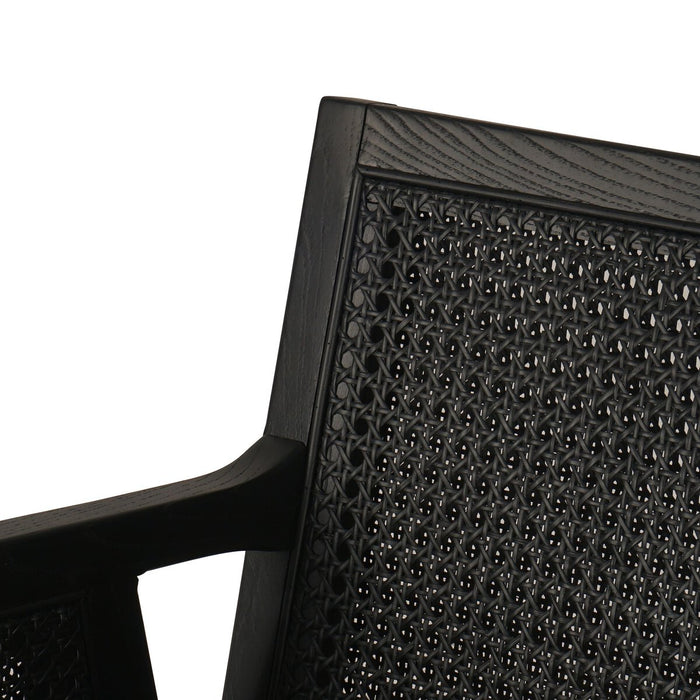 Ebony finished nettlewood frames a textural inlay of dark cane arms and back with top grain dark leather seat with brass kickplate counter stool shopkoehndesign calgary furniture shop amy koehn calgary designer