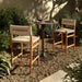 slim, tapered teak frames this woven all-weather wicker counter stool shopkoehndesign interior design calgary furniture shop amy koehn calgary designer  