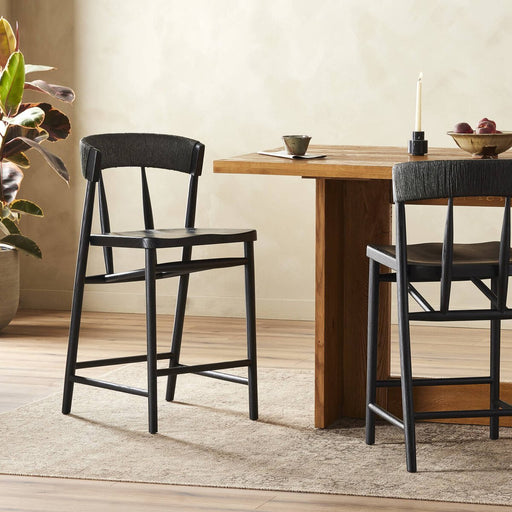 solid oak stool with tapered legs and angled seat and rattan wrapped paper rush back rest in black solid oak shopkoehndesign calgary furniture shop amy koehn calgary designer