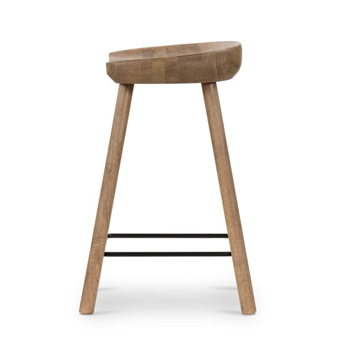 armless and backless sculpted seat parawood with black metal footrest natural solid wood stool shopkoehndesign calgary furniture shop amy koehn calgary designer