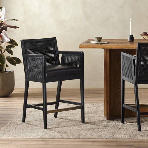 Ebony finished nettlewood frames a textural inlay of dark cane arms and back with top grain dark leather seat  counter stool shopkoehndesign calgary furniture shop amy koehn calgary designer